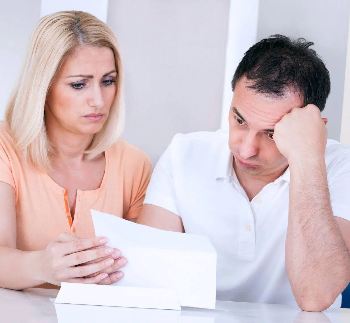 Credit Repair Lawyers Couple Looking At Bills