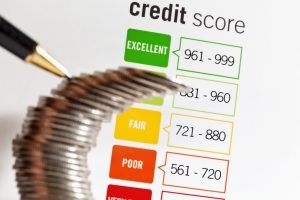 Protecting your credit score is important and not doing so will make it difficult or more expensive to borrow money. The falling stack of coins represents the vulnerability of an individual’s creditworthiness.