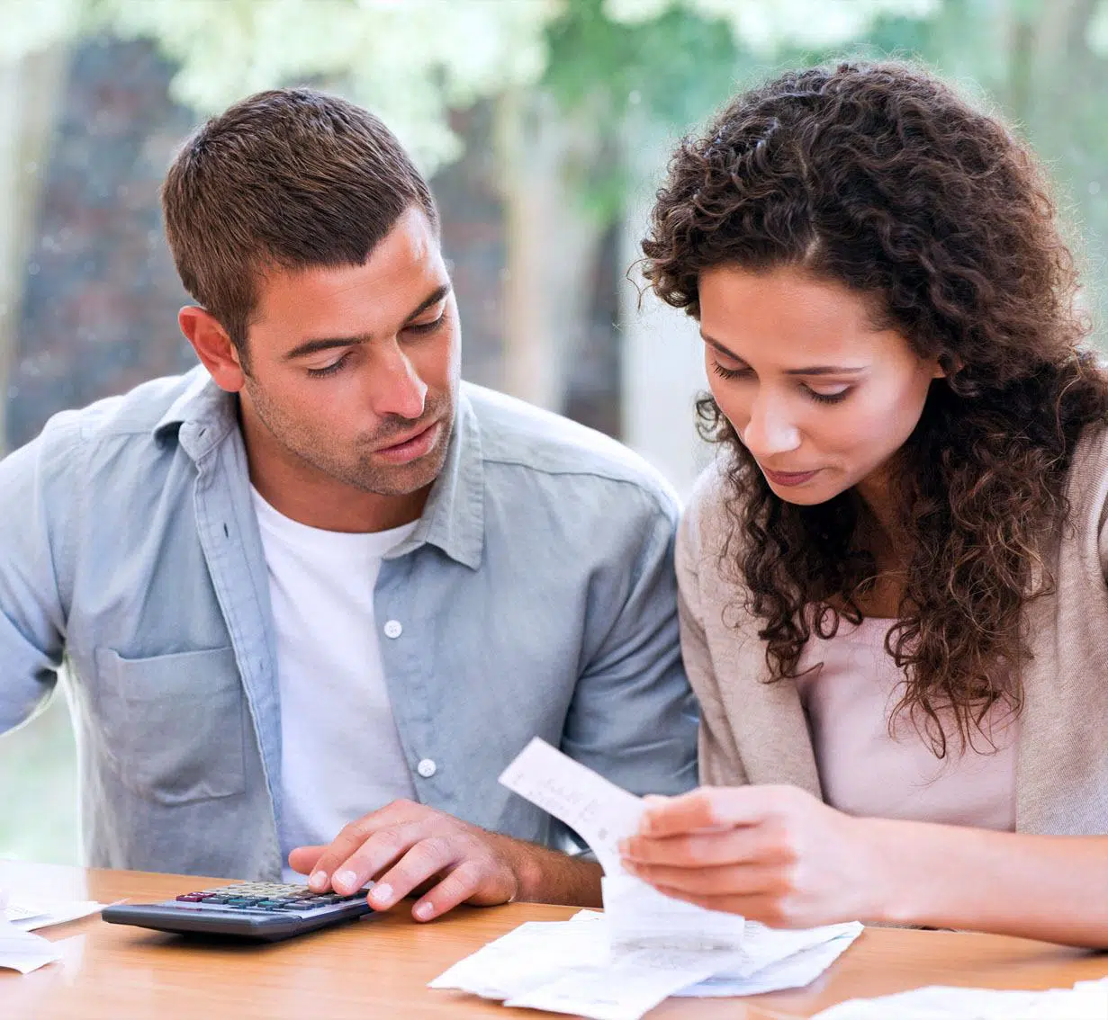 Credit Repair Lawyers Couple Looking at Bills
